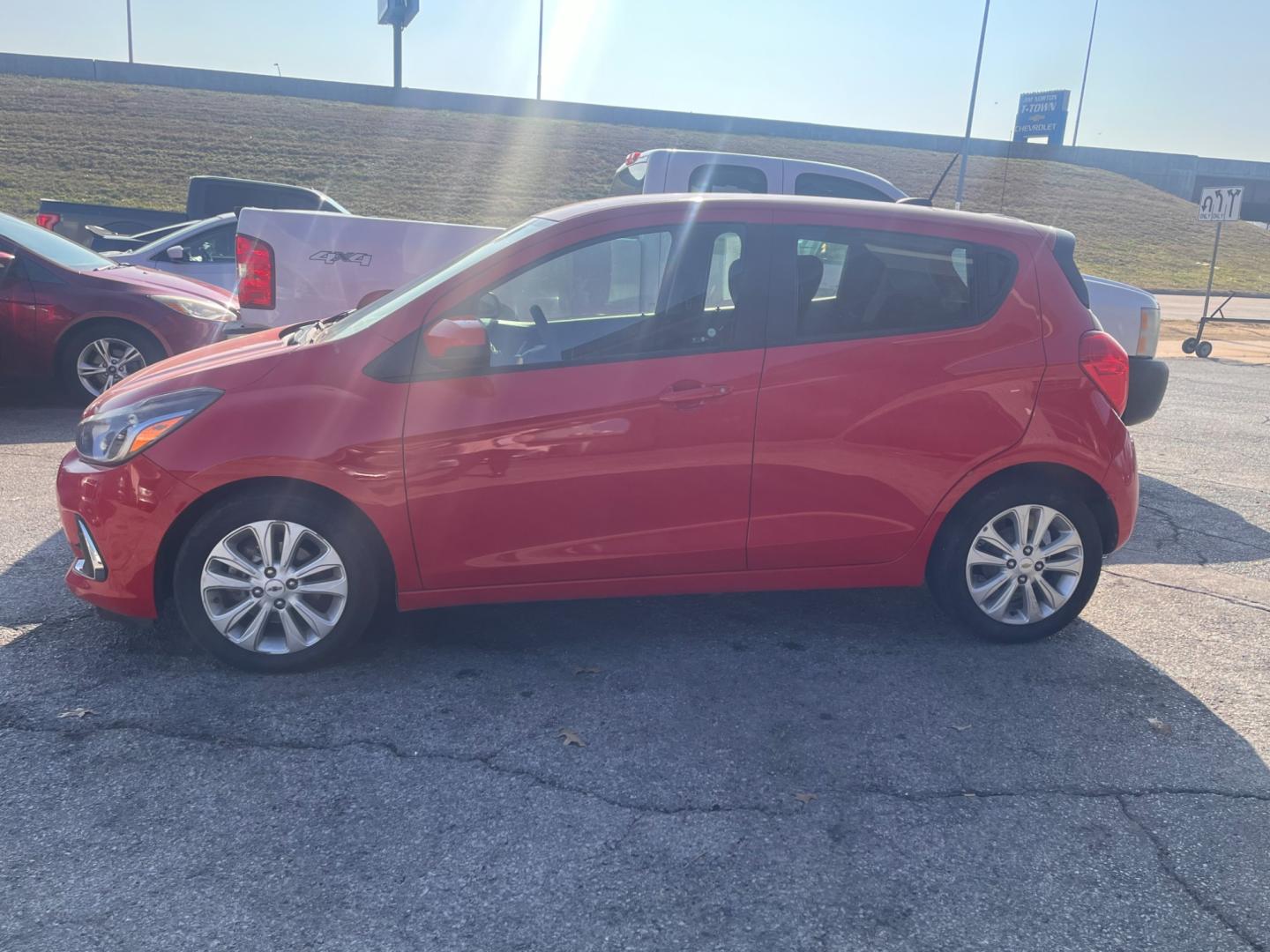 2017 RED CHEVROLET SPARK 1LT 1LT CVT (KL8CD6SA9HC) with an 1.4L L4 16V DOHC engine, CVT transmission, located at 8101 E. Skelly Dr., Tulsa, OK, 74129, (918) 592-3593, 36.121891, -95.888802 - Photo#4